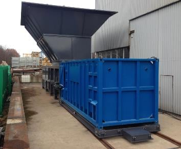 Knowsley Compactor with container at factory r